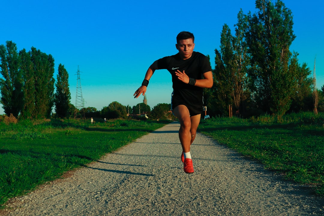 Runner consuming energy gel during outdoor training run