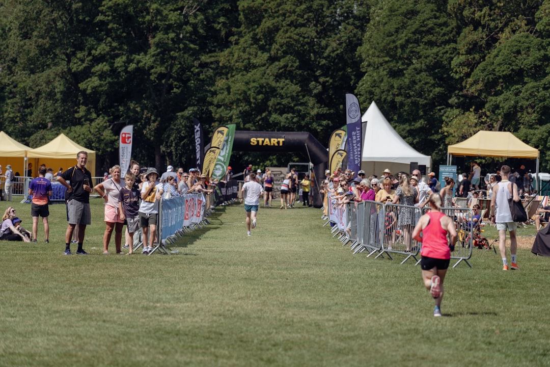 Marathon runners crossing the finish line at a UK race event