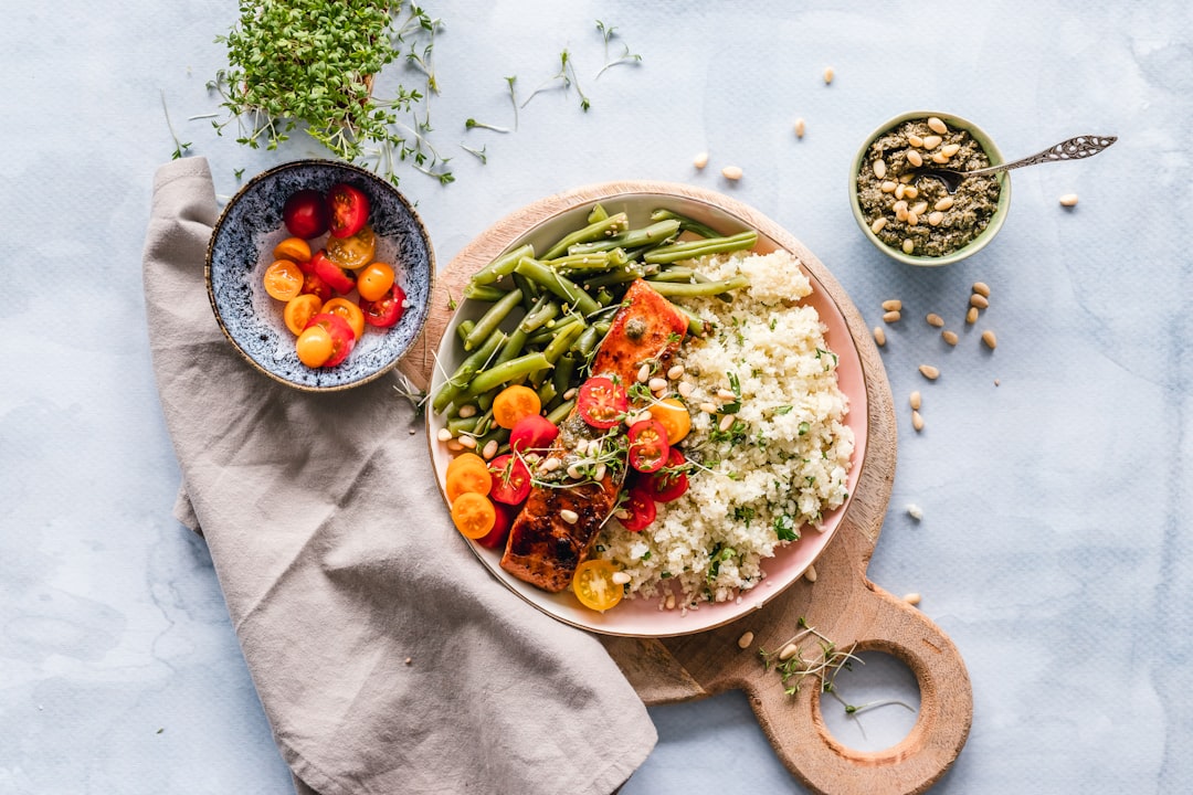 Runner preparing carbohydrate-rich meal with brown rice and vegetables for race preparation