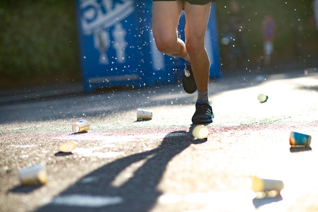 Runner refueling at an aid station during an ultramarathon race